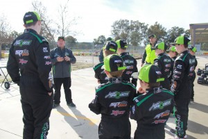 Head Instructor Troy Hunt speaks with a group of the Junior Sprockets participants.